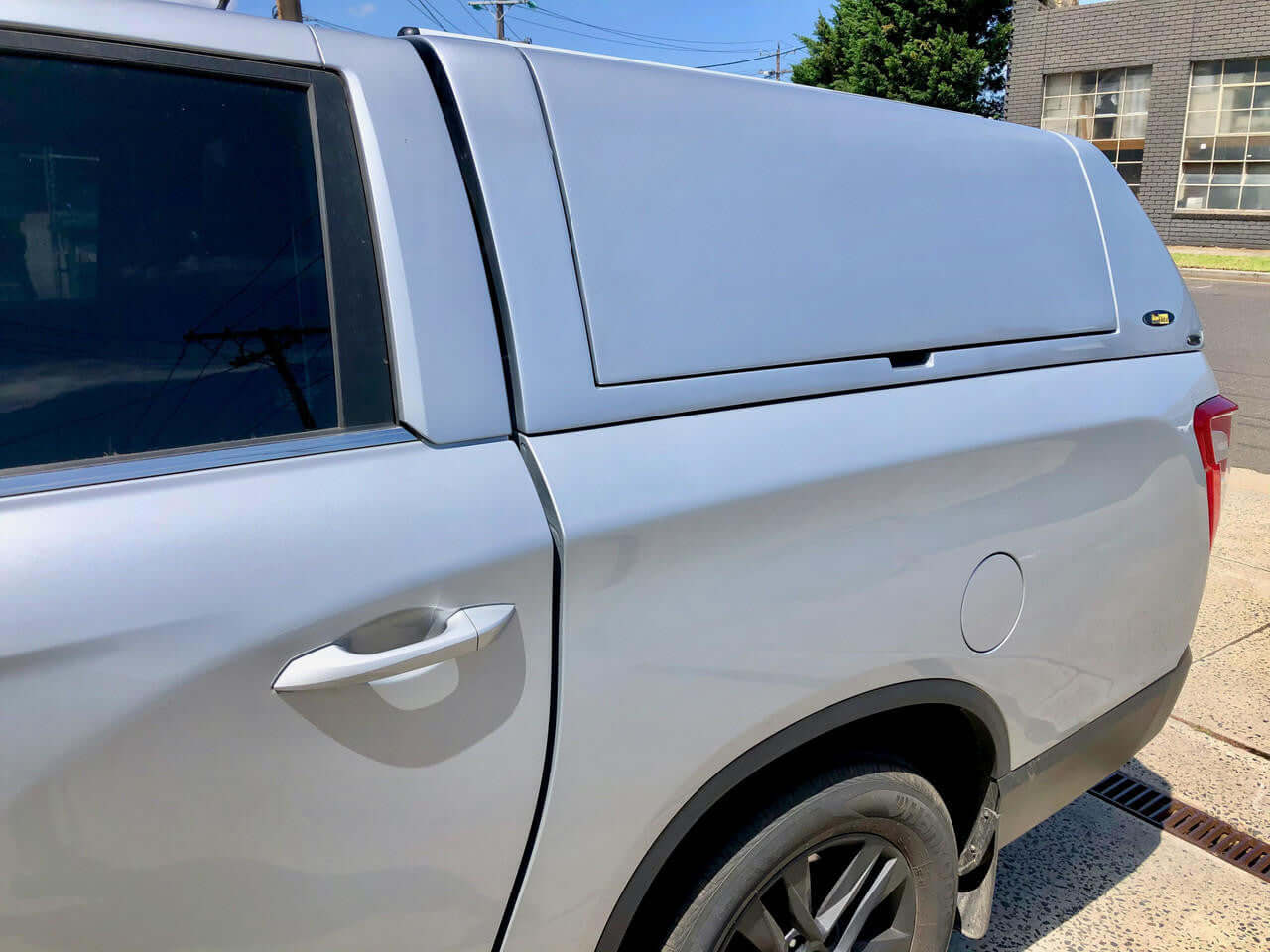 SsangYong Musso XLV Canopy fitted on silver pickup truck, side view