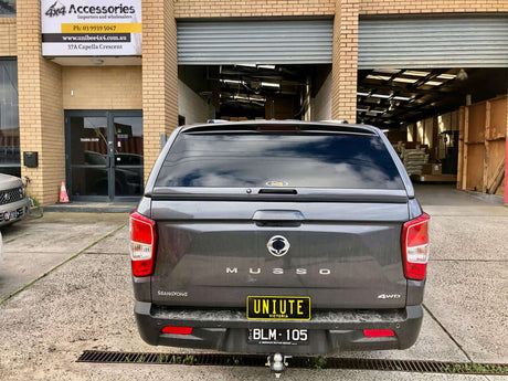 Rear view of SsangYong Musso XLV Canopy at 4x4 accessories store.