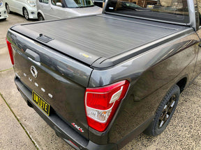 Manual roller shutter for KGM Musso short tub 2018-2026 — installed rear view | UniUte