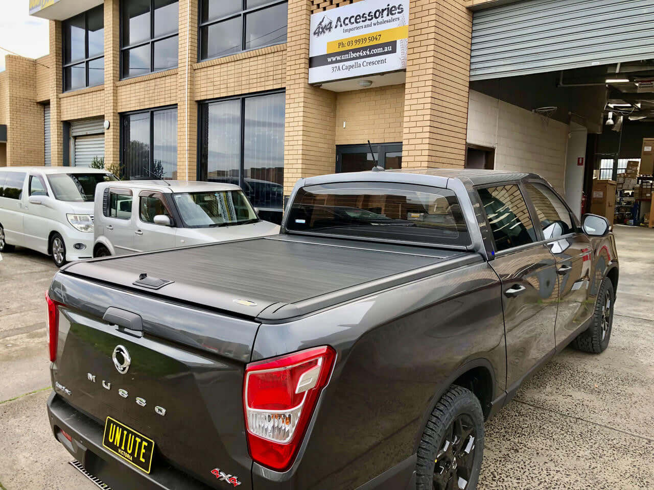 ssangyong musso roller shutter UniUte Gen2 Manual on SsangYong Musso XLV 2018-2025 parked outside a garage