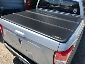 Tri-fold hard lid tonneau cover for SsangYong Musso XLV long tub 2018-2026 — closed | UniUte