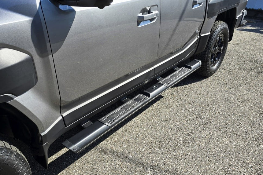 KIA Tasman side steps 2025+ black steel side bars for enhanced access and protection, perfect for off-road and city driving