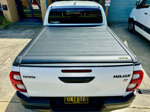 Toyota Hilux SR5 with UniUte EGen2 Electric Black Roller Shutter installed, showcasing a sleek hilux roller shutter design