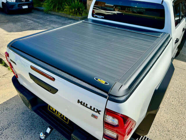 UniUte EGen2 electric black hilux roller shutter on Toyota SR5 2015-2025, enhancing 4x4 utility and protection.