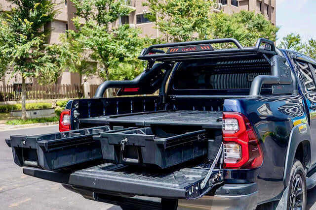 Toyota Hilux drawers open, showcasing versatile storage solutions for adventure enthusiasts.