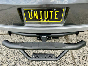 Universal rear hitch step for tow bars — installed on black ute | UniUte