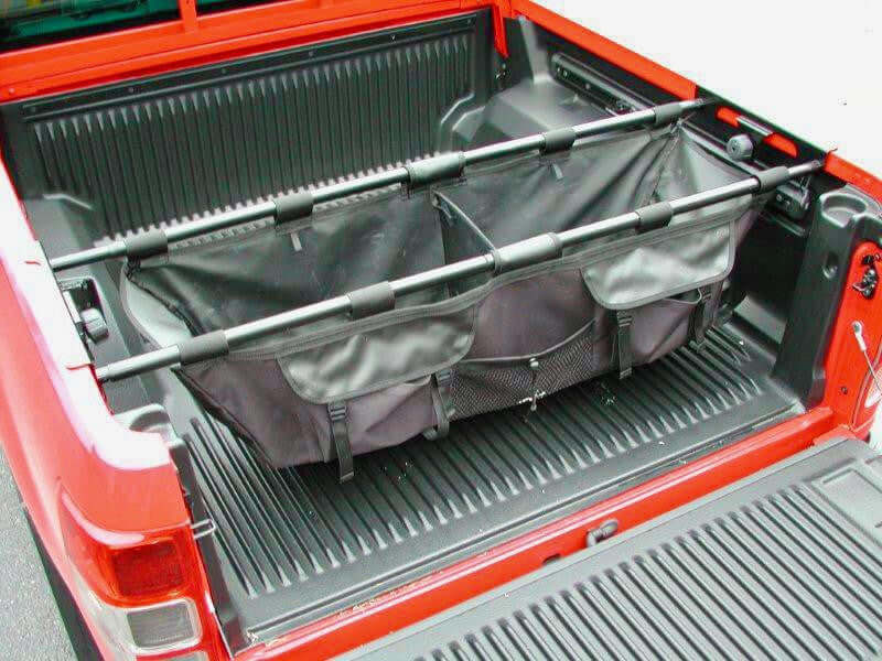 Universal ute tub organiser hammock installed in a red ute tray, showcasing versatile cargo storage solution.
