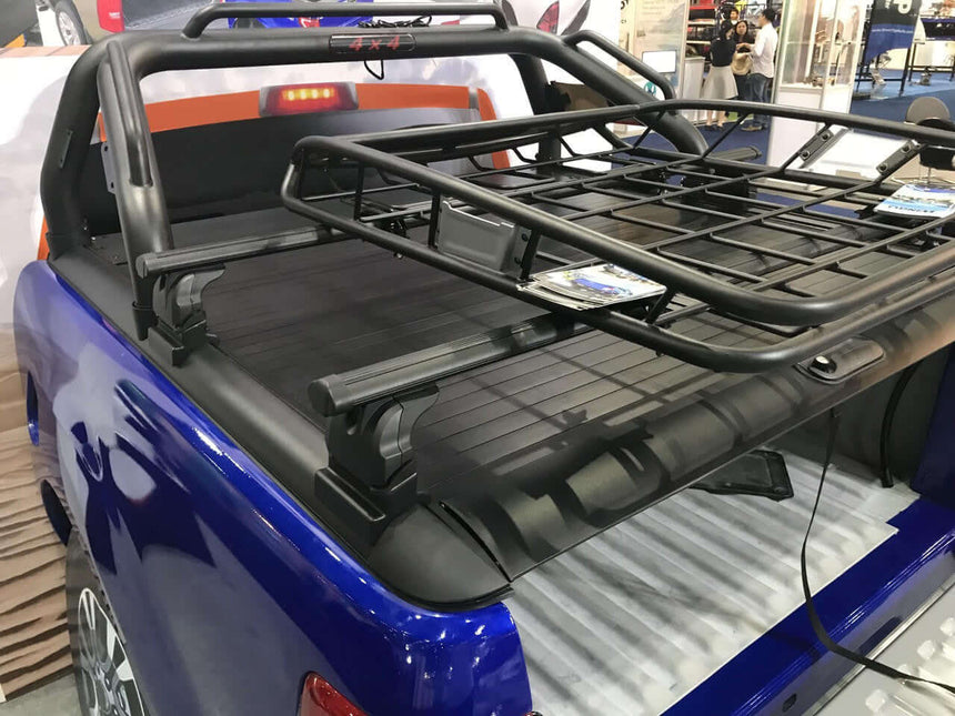 Roller shutter roof racks on truck bed showcasing cross bars for UniUte Gen1.