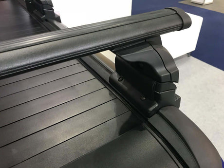 Close-up of black roller shutter roof racks cross bars on UniUte Gen1 roller shutter, highlighting stylish design and durability.