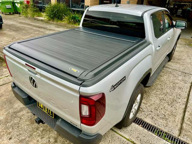 Volkswagen Amarok 2023 with UniUte EGen2 amarok roller cover, showcasing sleek electric black roller lid shutter for enhanced utility.