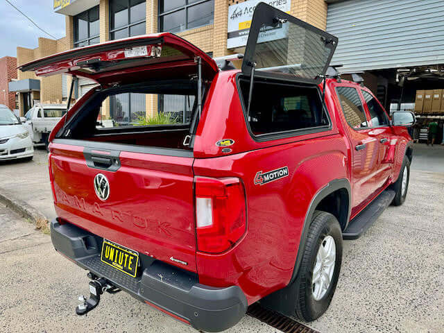Red Volkswagen Amarok canopy, rear view showcasing amarok canopy design and functionality for 2023 model.