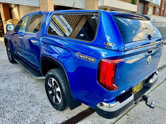 New Volkswagen Amarok canopy 2023, featuring amarok canopy and 4Motion badge, parked outdoors.