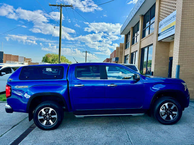 Volkswagen Amarok canopy, side view, 2023 model, parked on street