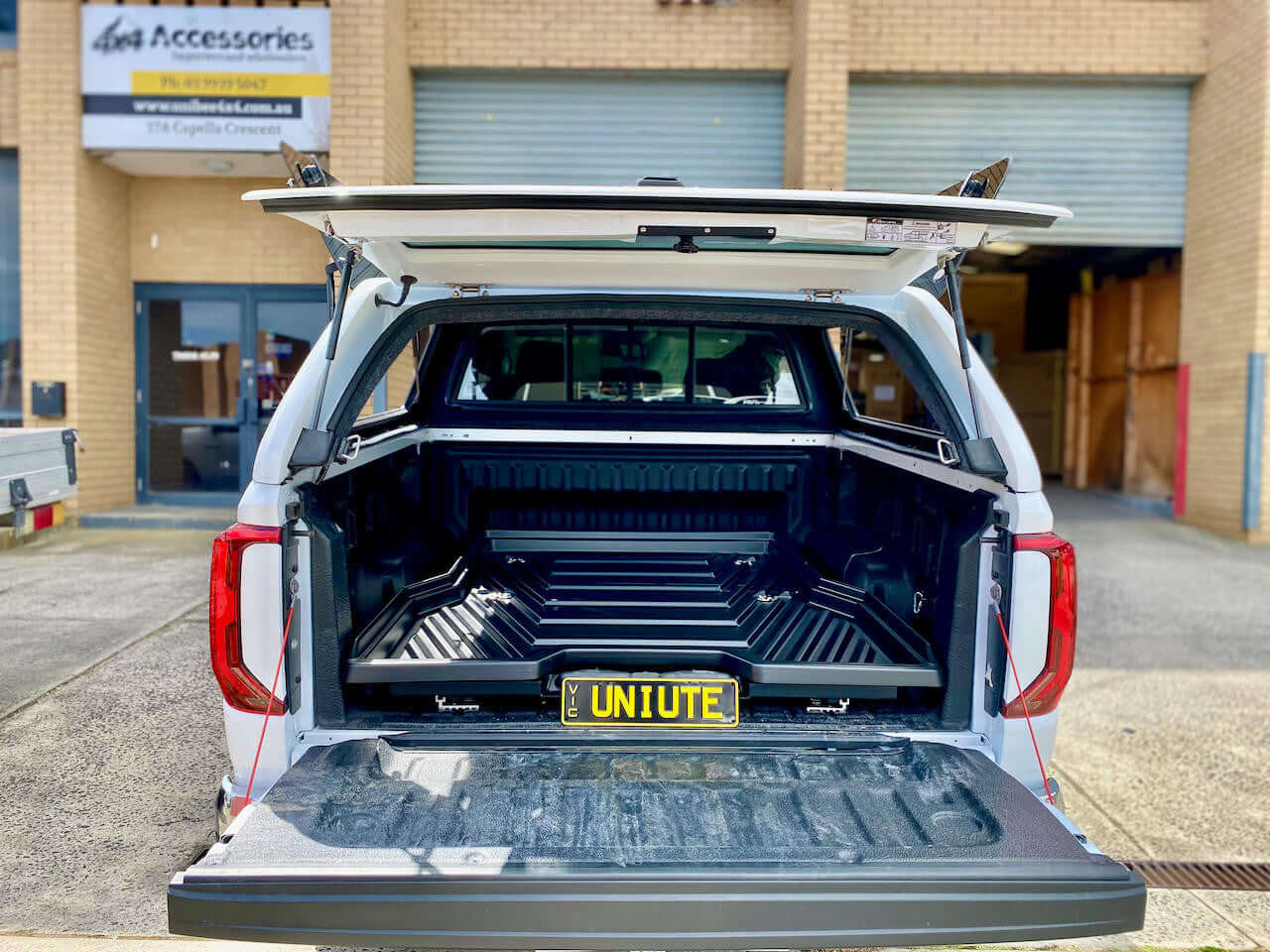 Open view of a Volkswagen Amarok canopy showcasing spacious storage, highlighting the amarok canopy.