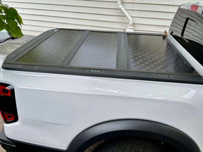 Quad-fold hard lid for Volkswagen Amarok 2023+ — installed closed view | UniUte