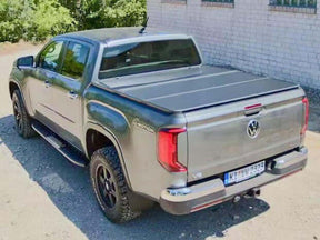 Tri-fold hard lid for Volkswagen Amarok 2023-2026 — installed closed view | UniUte