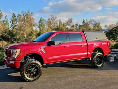 Red truck with Ute Canopy parked outdoors