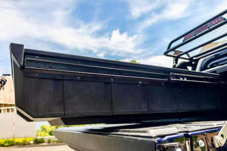 Four Wheel Drive Drawers installed in a rugged off-road vehicle under a blue sky, showcasing innovative storage solutions for adventurers.