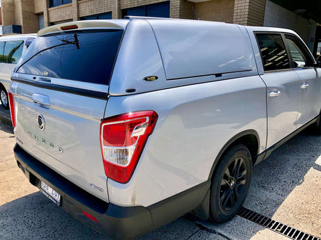 Silver pickup truck with Canopy Rockhampton installed, parked outdoors