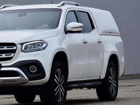 White 4x4 vehicle with WA Canopy in outdoor setting