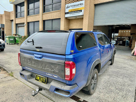 Blue 2024 T60 Max parked outside a building, showcasing the versatility of the LDV Ute.