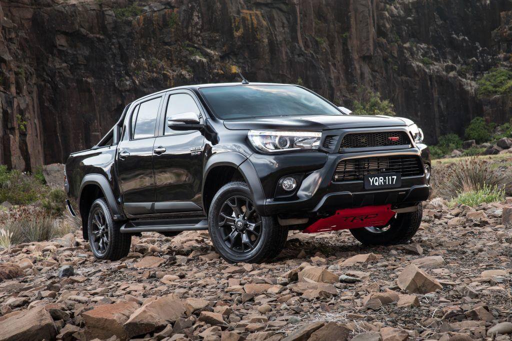 Black Toyota utes on rocky terrain highlighting durability and style for all driving needs.