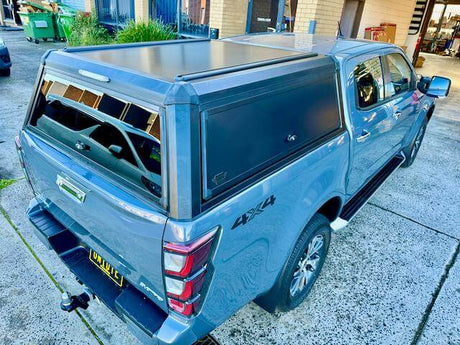Blue ute with a sleek canopy, showcasing durable and affordable canopies for utes. Perfect for outdoor adventures and utility.