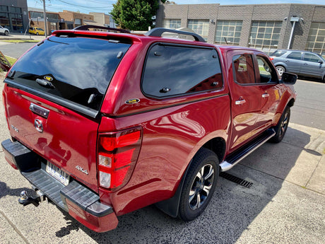 Red BT50 truck with canopy for BT50 in urban setting