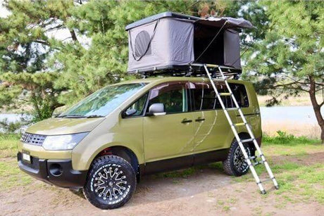 Mitsubishi Delica D5 with rooftop tent, showcased with UniUte accessories for enhanced 4x4 adventure.