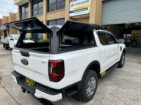 Ford Ranger truck with Next Gen Ranger Canopy open showcasing versatile storage options.