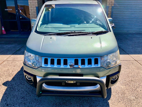 SUV with a front-mounted Nudge Bar for off-road protection and style enhancement in urban environment