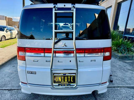 4WD Ladder installed on the rear of a white van for enhanced utility and easy roof access.