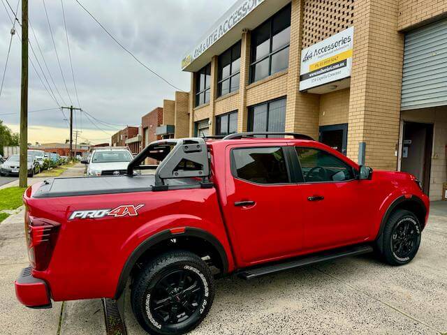 Red Dual Cab Ute parked in urban area, highlighting options for city adventurers.