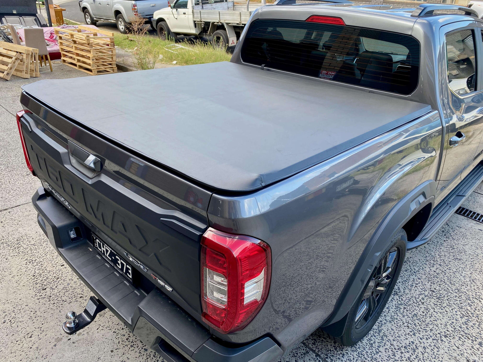 Sleek pickup truck featuring a durable Tonneau Cover for secure cargo protection.