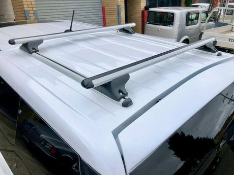 Roof Rack on Canopy installed on a white vehicle in an urban setting.