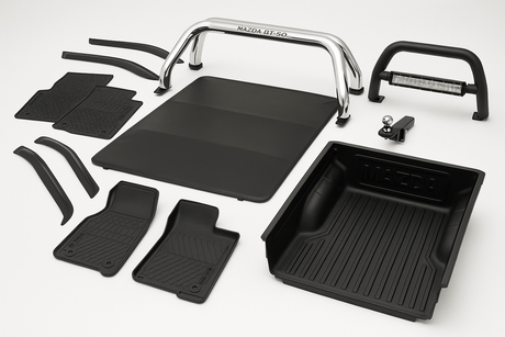 Various Mazda BT 50 accessories including mats, bed liner, and bumper guard, enhancing vehicle performance and style.