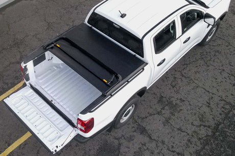 Red truck featuring a soft foldable ute tonneau covers by UniUte for secure, stylish tub protection.