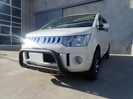 MITSUBISHI DELICA D5 ACCESSORIES on a white Delica D5 showcasing off-road capability with a rugged front bumper