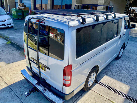 Toyota Hiace van with roof rack and ladder, showcasing premium Toyota Hiace Accessories for enhanced utility and style.