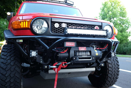 4x4 vehicle with UniUte RECOVERY WINCHES navigating rocky terrain