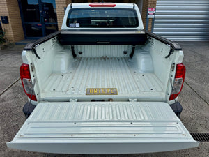 Nissan Navara NP300 roller shutter — rear three-quarter view with the shutter closed