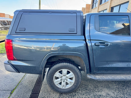 Triton MV stainless steel canopy — weather seals and mounting detail along the tub rail