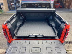 Sliding Tray for BYD Shark 6 in red ute, showcasing cargo access and hybrid-ready design.
