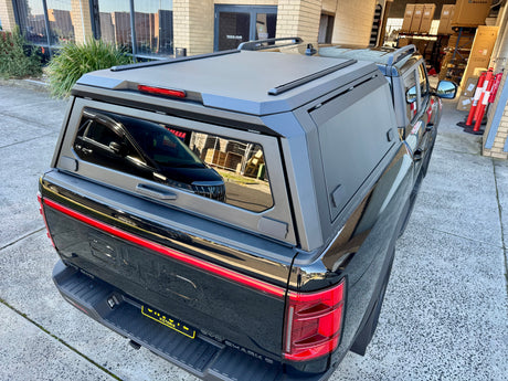 Stainless steel canopy for BYD Shark 6 — tinted glass window detail