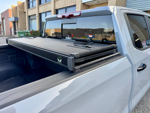 Chevrolet Silverado tri-fold lid — three-quarter rear view closed