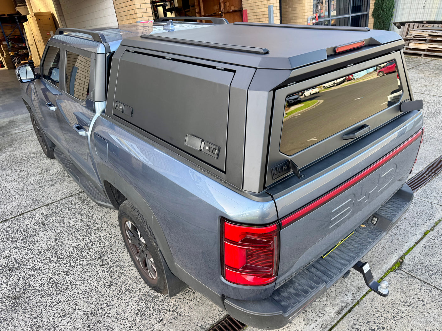 BYD Shark 6 steel canopy — gullwing door locking mechanism and seal detail