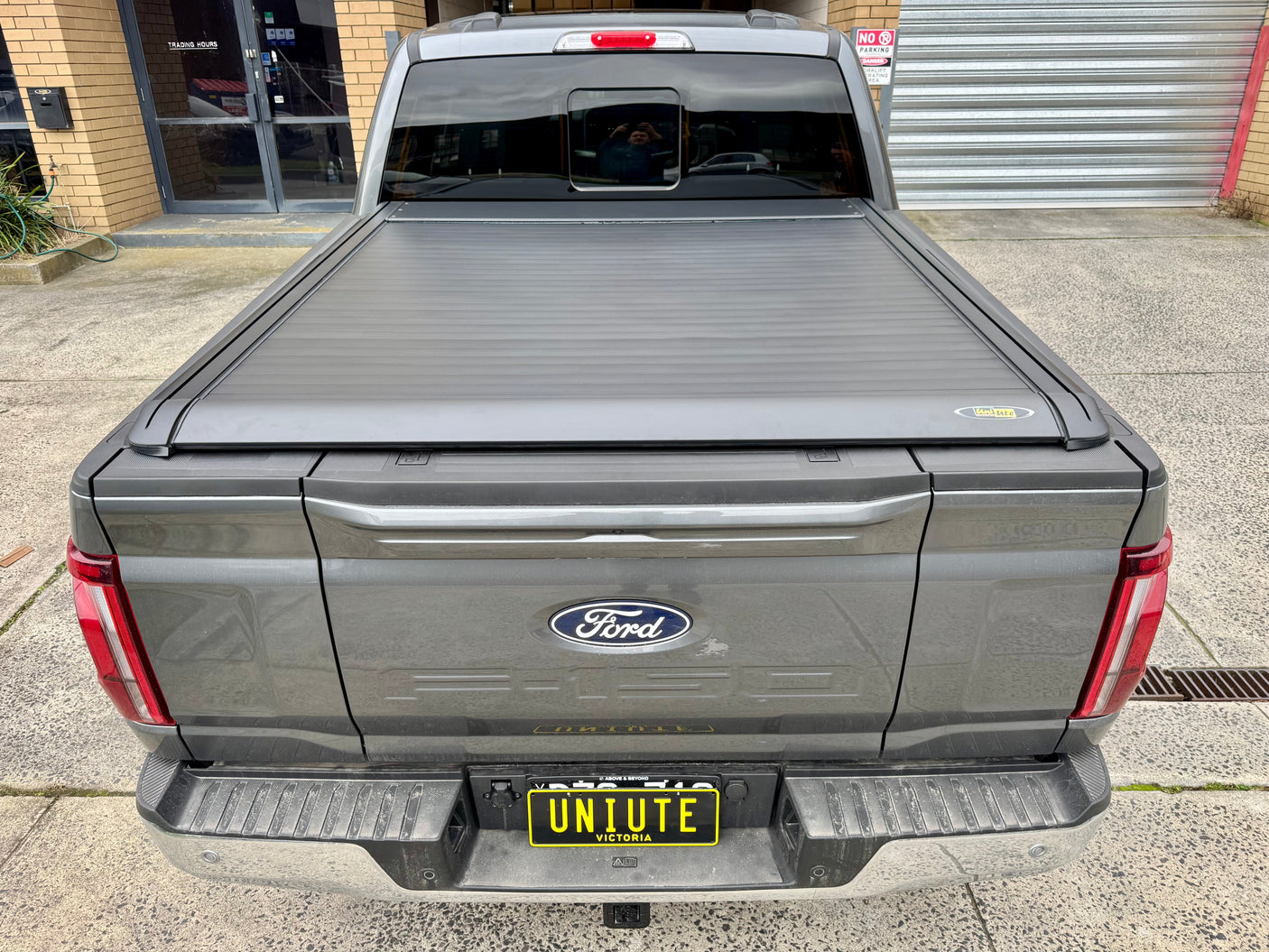 Ford F-150 5'5" bed electric roller shutter — rolled back into the canister at the bulkhead