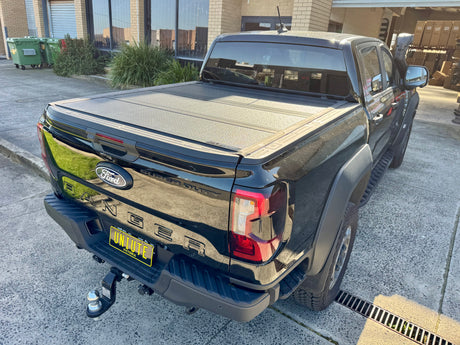 Ford Ranger NextGen with quad-fold hard lid — side view showing four-panel profile