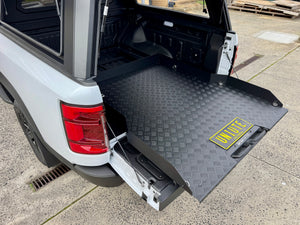 BYD Shark 6 sliding tray — textured aluminium tray surface and side rail detail