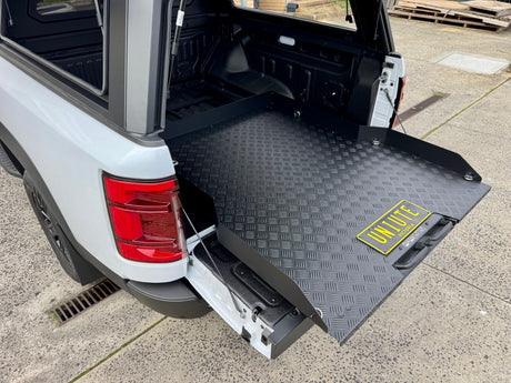 BYD Shark 6 sliding tray — textured aluminium tray surface and side rail detail
